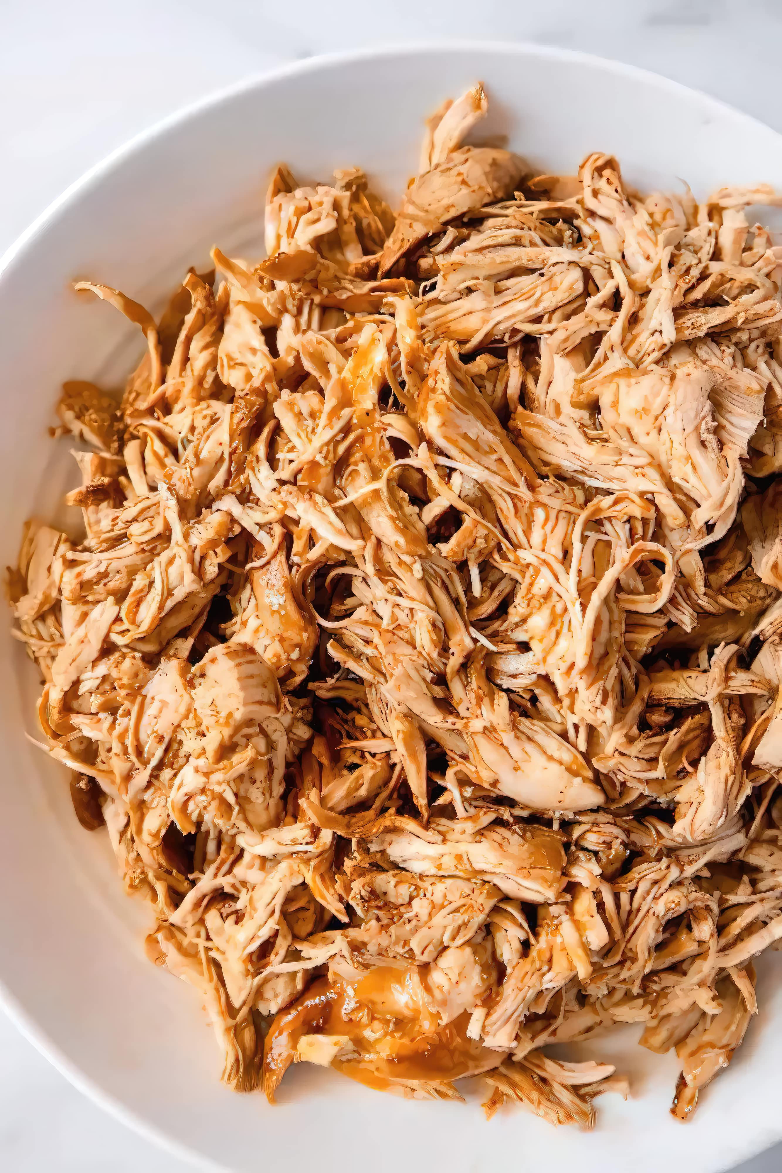 Close-up of slow cooker shredded chicken