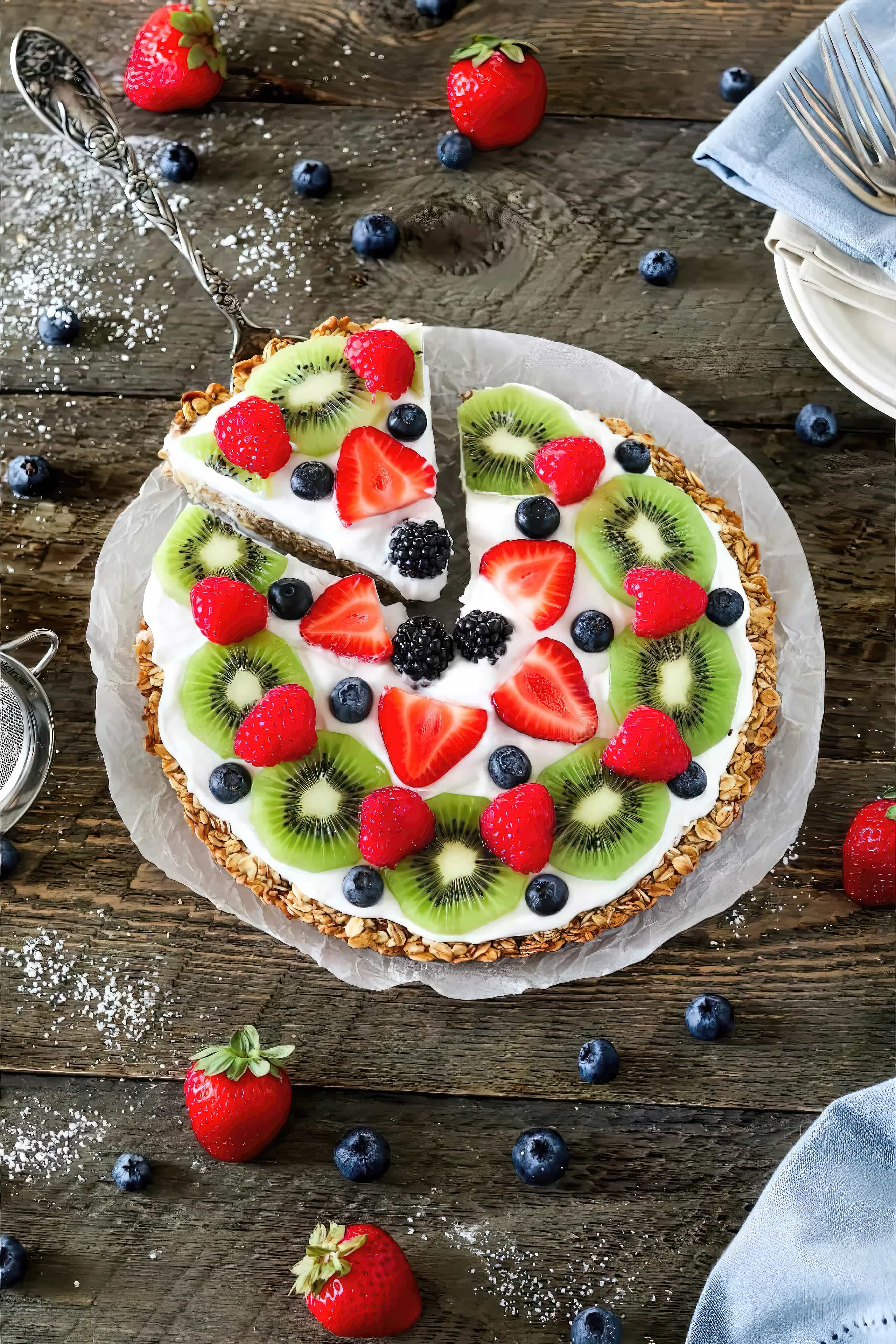 Close-up of healthy fruit pizza with coconut whip