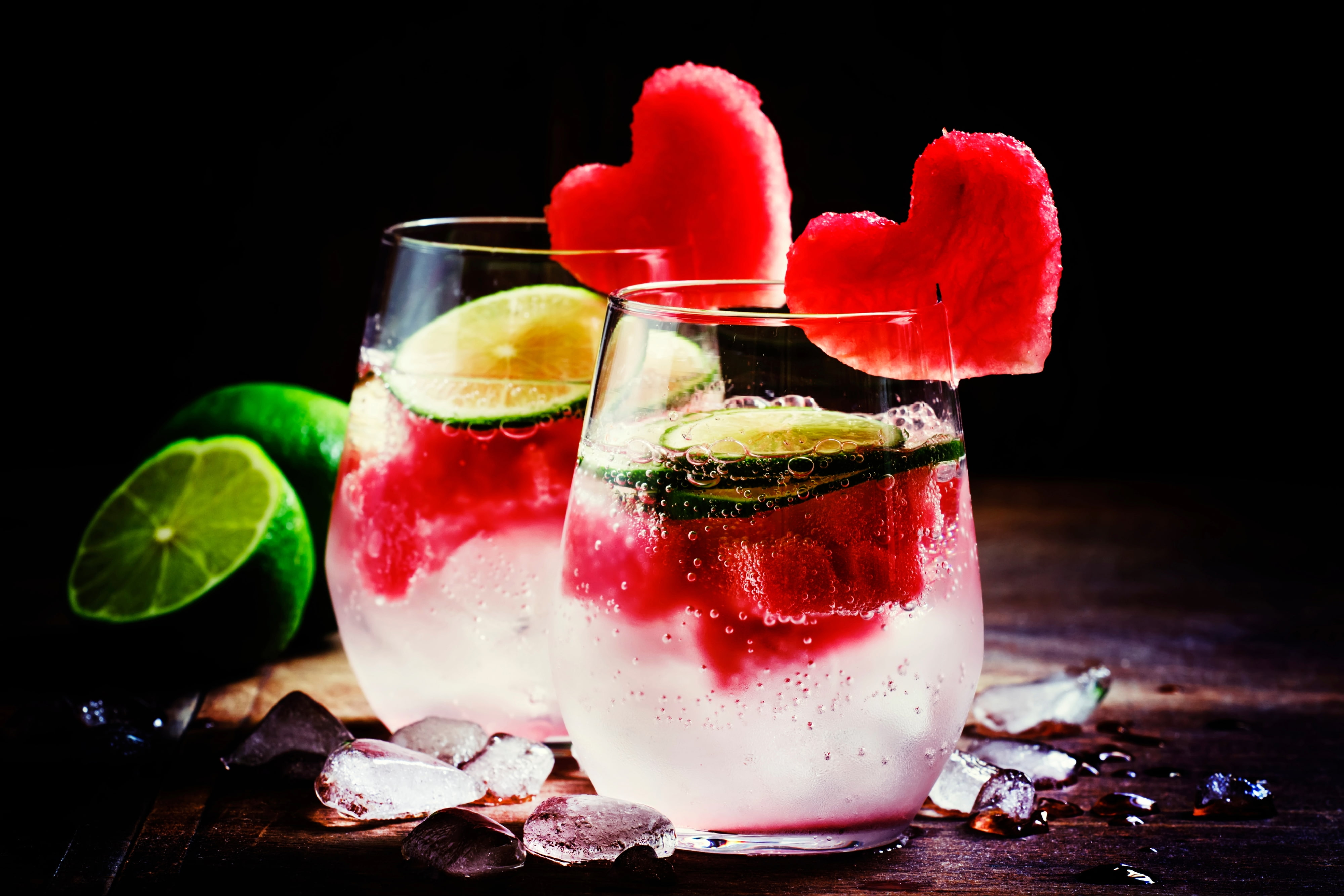 Valentine's Day cocktail with red fruit hearts, selective focus